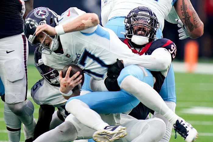 Ryan Tannehill is sacked by Houston Texans defensive end Derek Barnett (95) on a fourth down during the fourth quarter at NRG Stadium in Houston